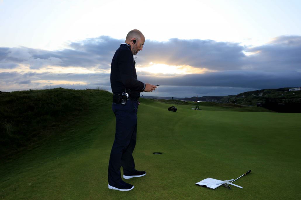 Golfer by the hole